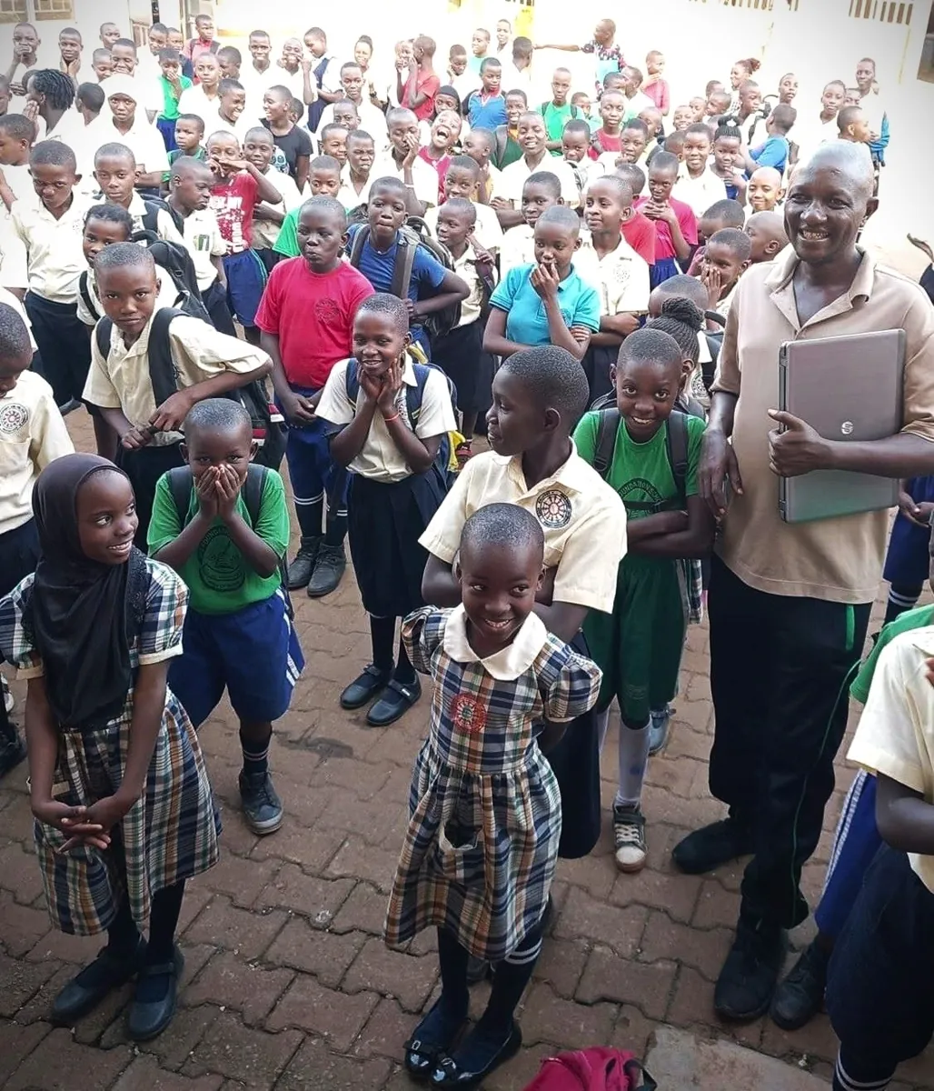 Children and adults gathered together at the school