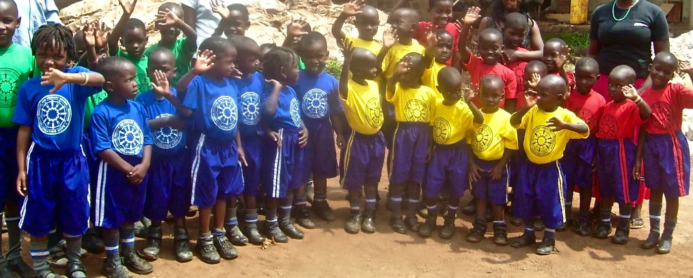 A group of children in colorful sports uniforms standing together